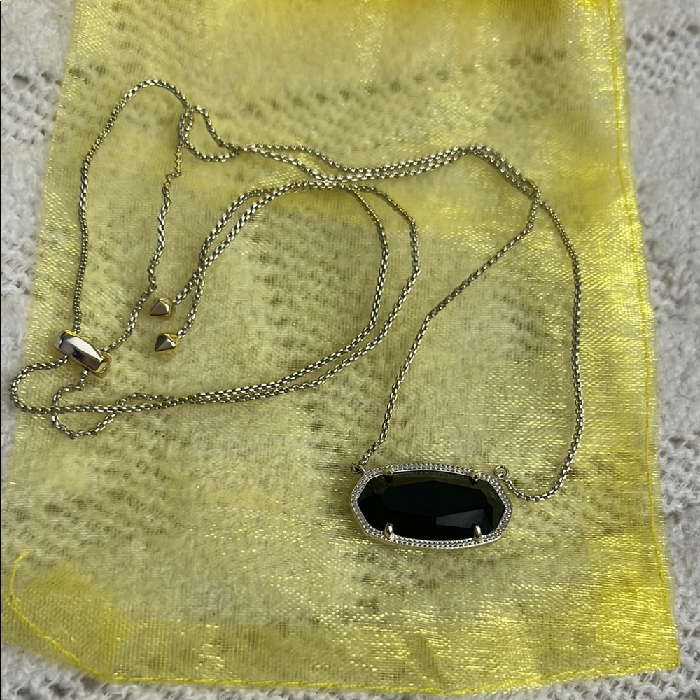 Elegant Gold Necklace with Black Pendant